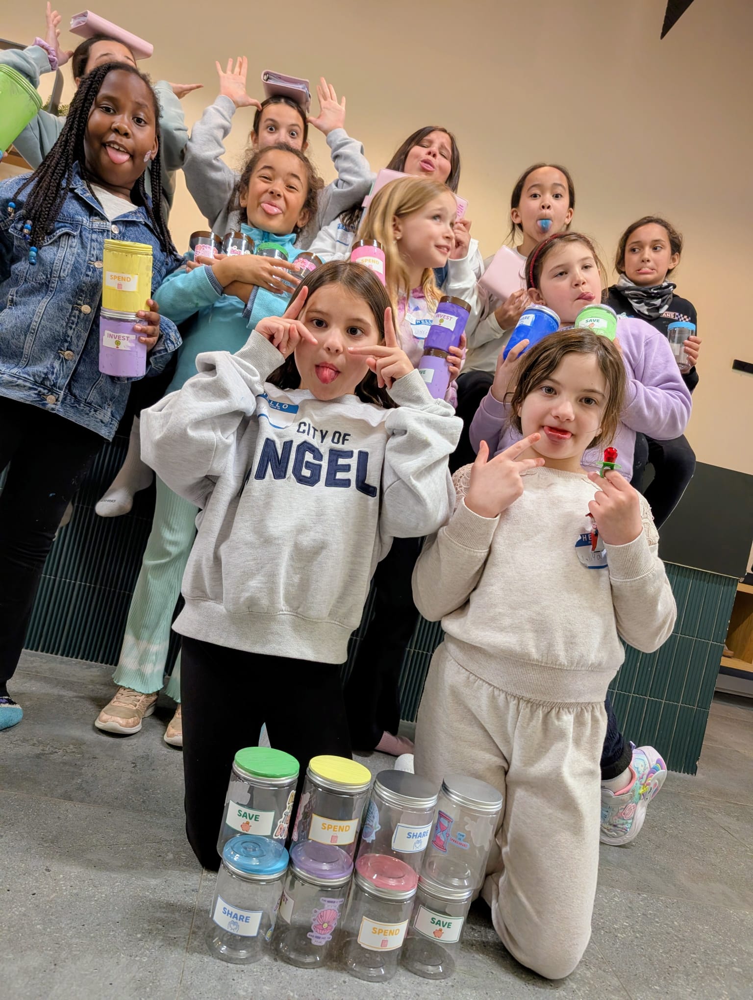 Full group of girls at the Wealth & Wellness Summer Camp — energy and smiles